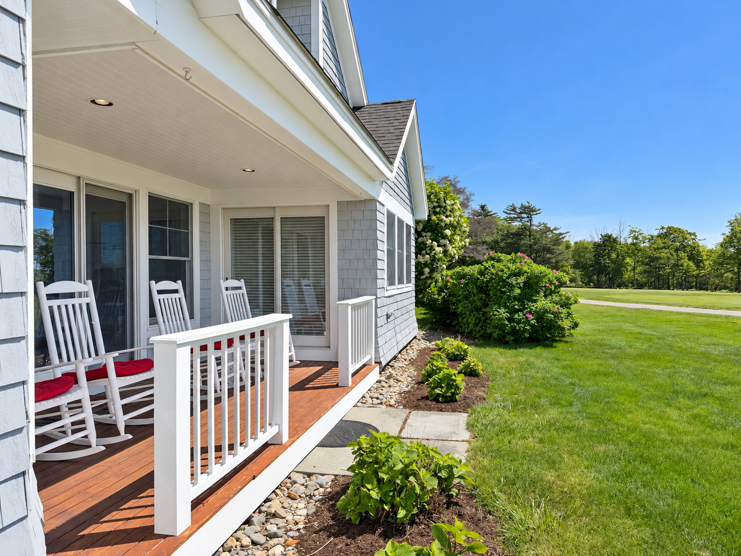 Cottage Rental 67 porch with rocking chairs and ocean view